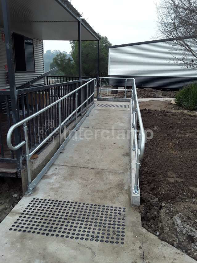 Walkway fitted with Interclamp DDA modular handrailing, ensuring optimal safety and stability with a smooth, continuous design in line with Australian handrail standards.